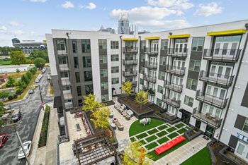 an aerial view of an apartment complex with a green courtyard at Link Apartments® Mint Street, North Carolina